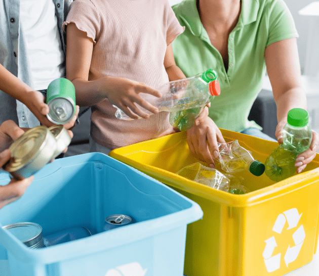 Family sorting through recycling